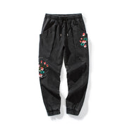 Jeans-Jogginghose mit Blumen-Stickerei „Frieden“